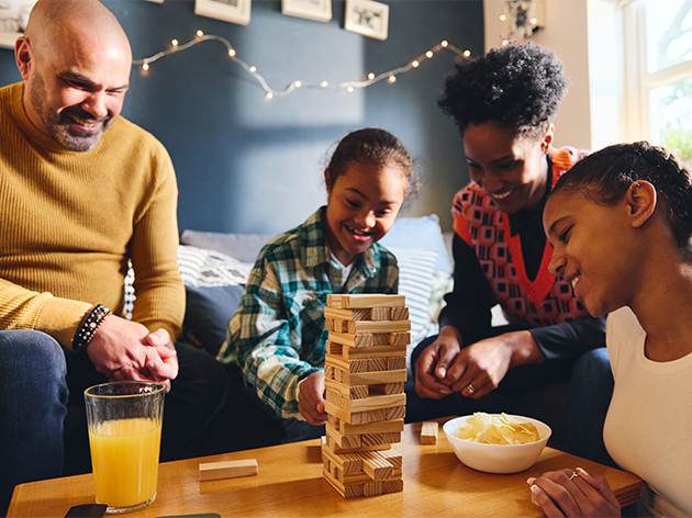 Family playing a game in their living room