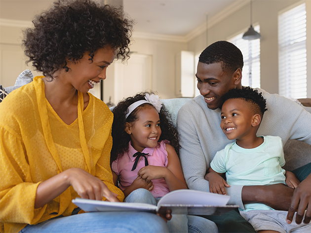 family looking at a book