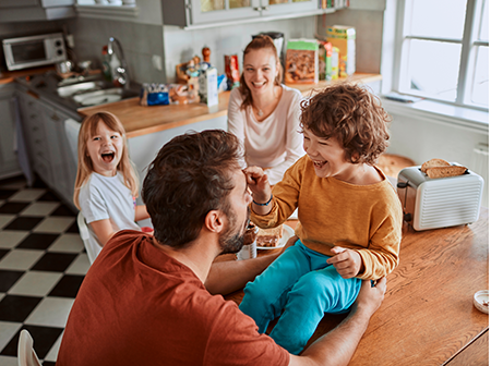Family eating breakfast in their kitchen