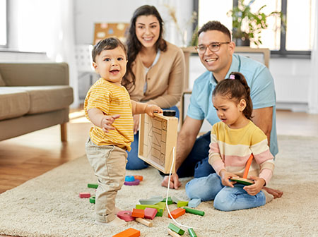 Family playing with toys in home