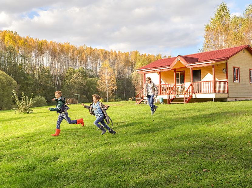 Family playing outside rural home