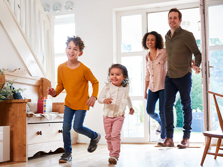 Family entering home