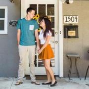 Couple in front of home