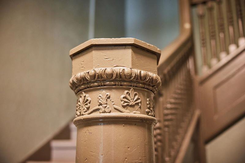 Detail shot of the ornate railings preserved at Jazz Hill Apartments