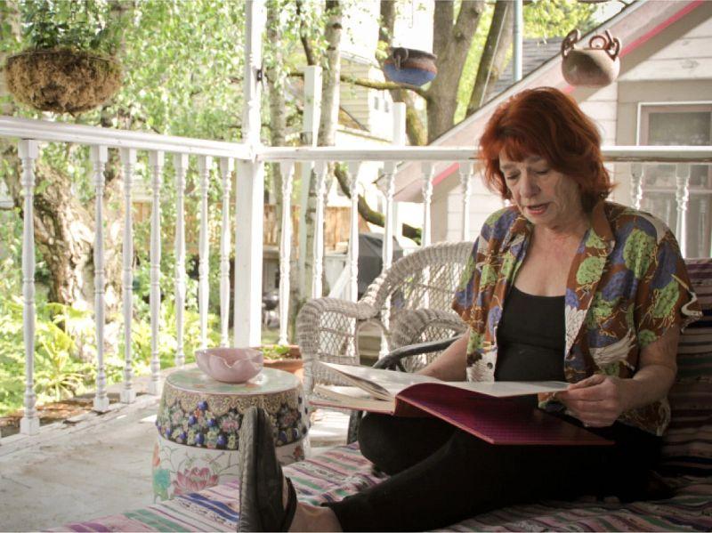 lady sitting at the porch reading